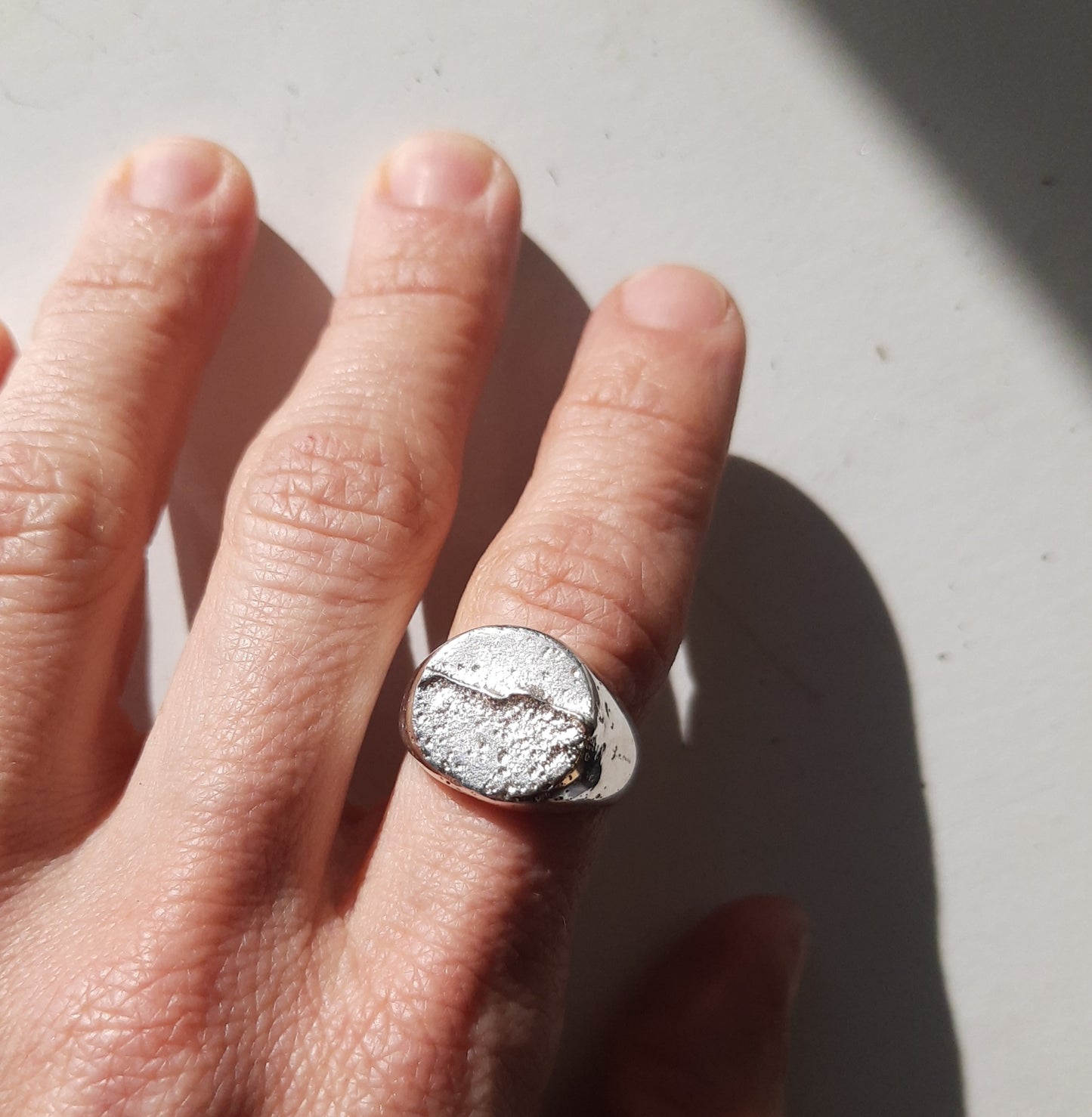 Sand-cast signet ring handmade by VerdeRame Jewels