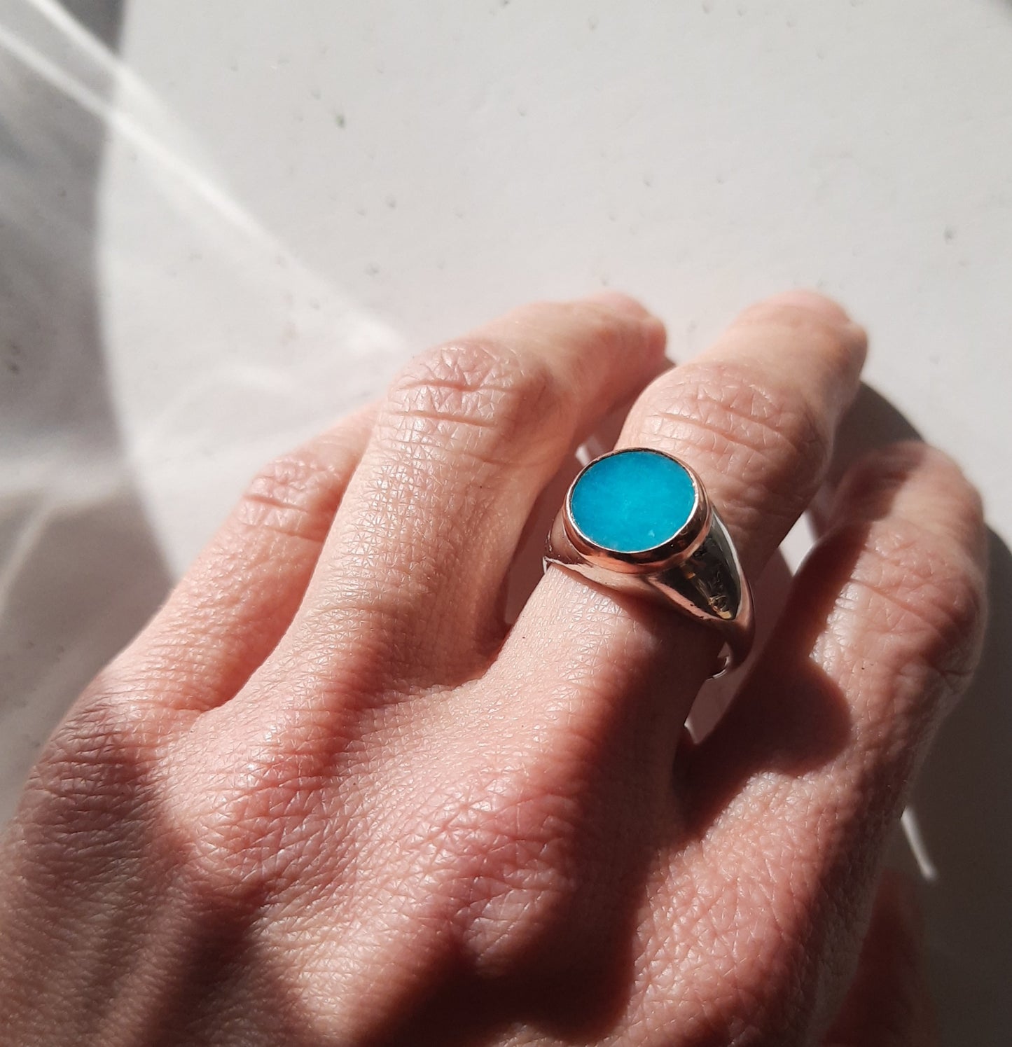Sand-cast signet ring with amazonite slab in copper bezel by VerdeRame Jewels