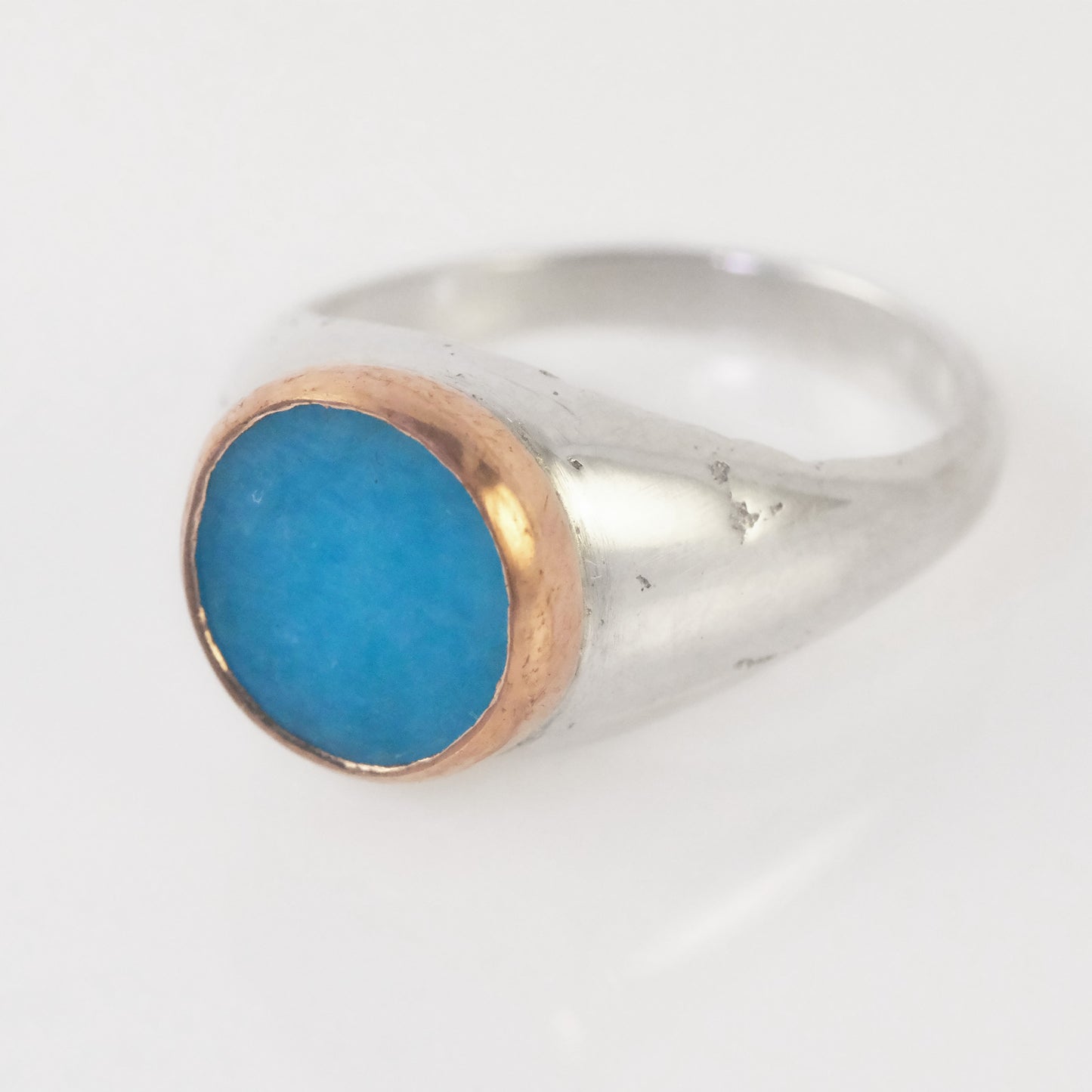 Sand-cast signet ring with amazonite slab in copper bezel by VerdeRame Jewels