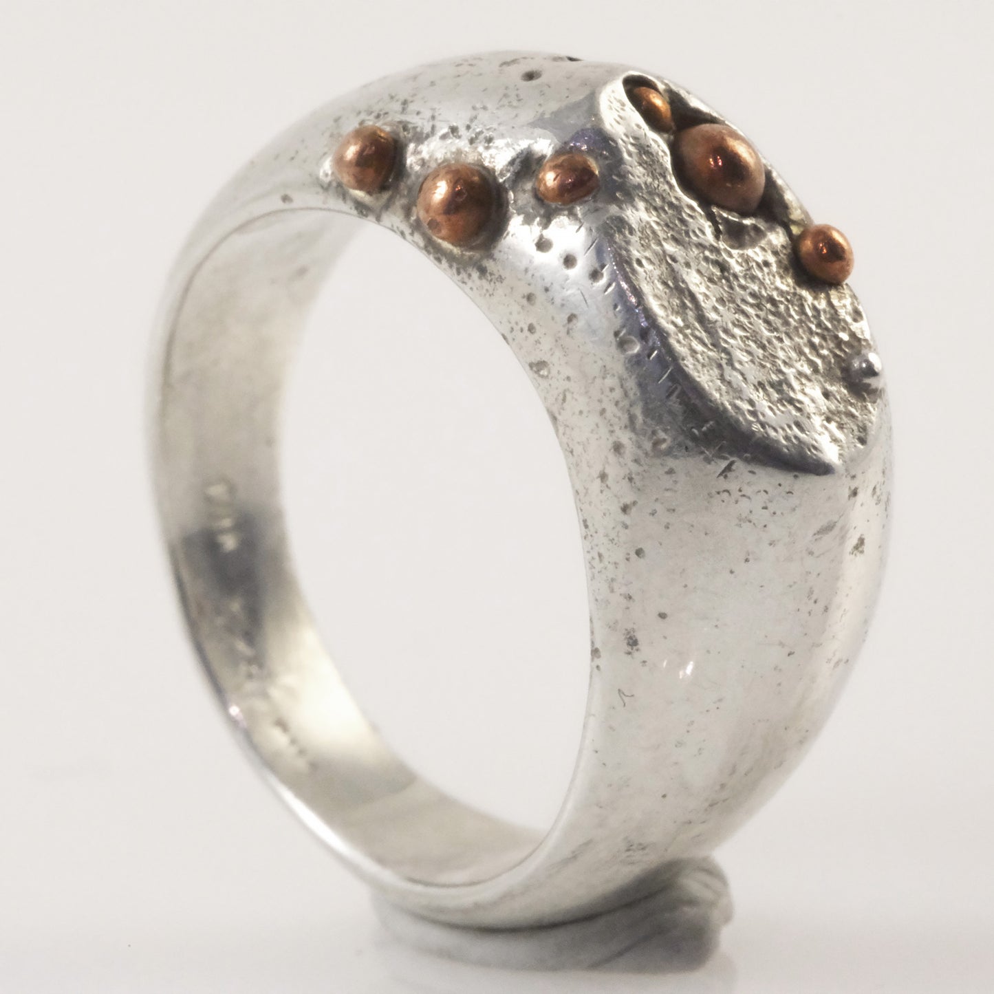 Sand-cast signet ring with copper granules handmade by VerdeRame Jewels