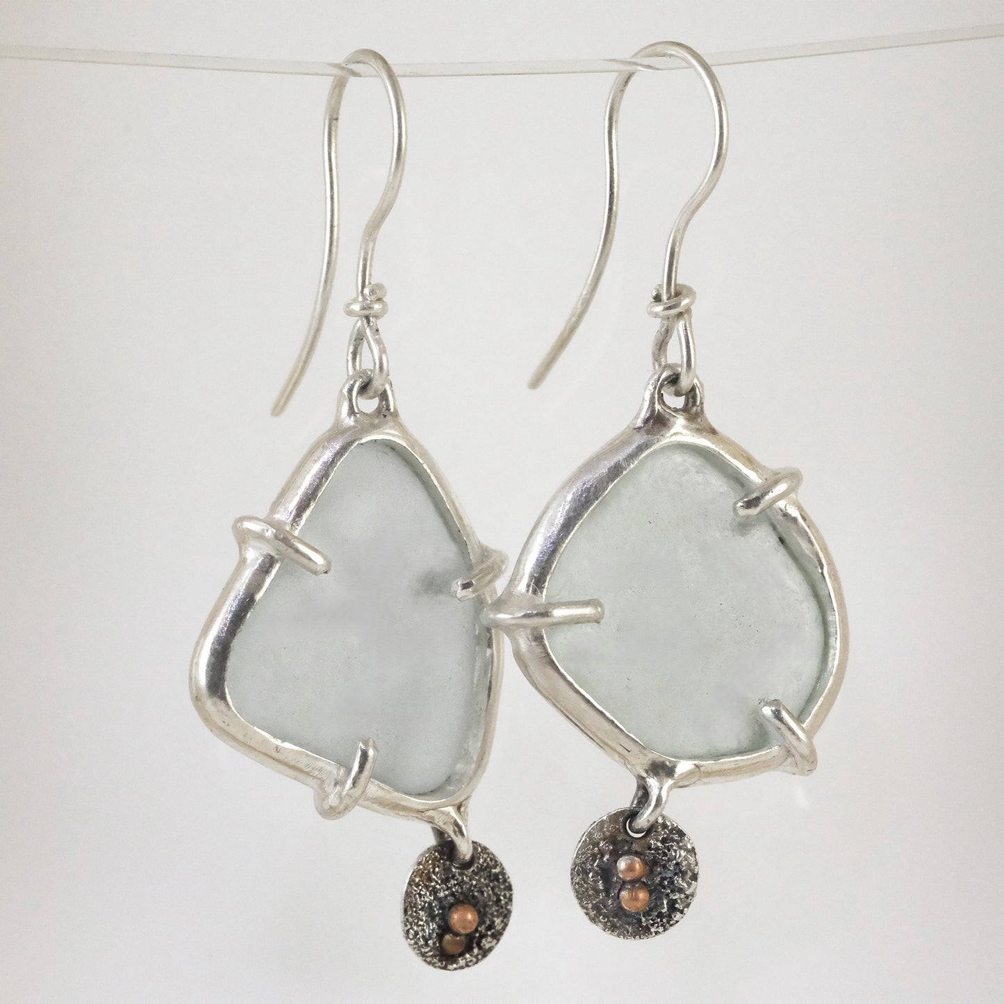 Sea glass silver dangle earrings handmade by VerdeRame Jewels