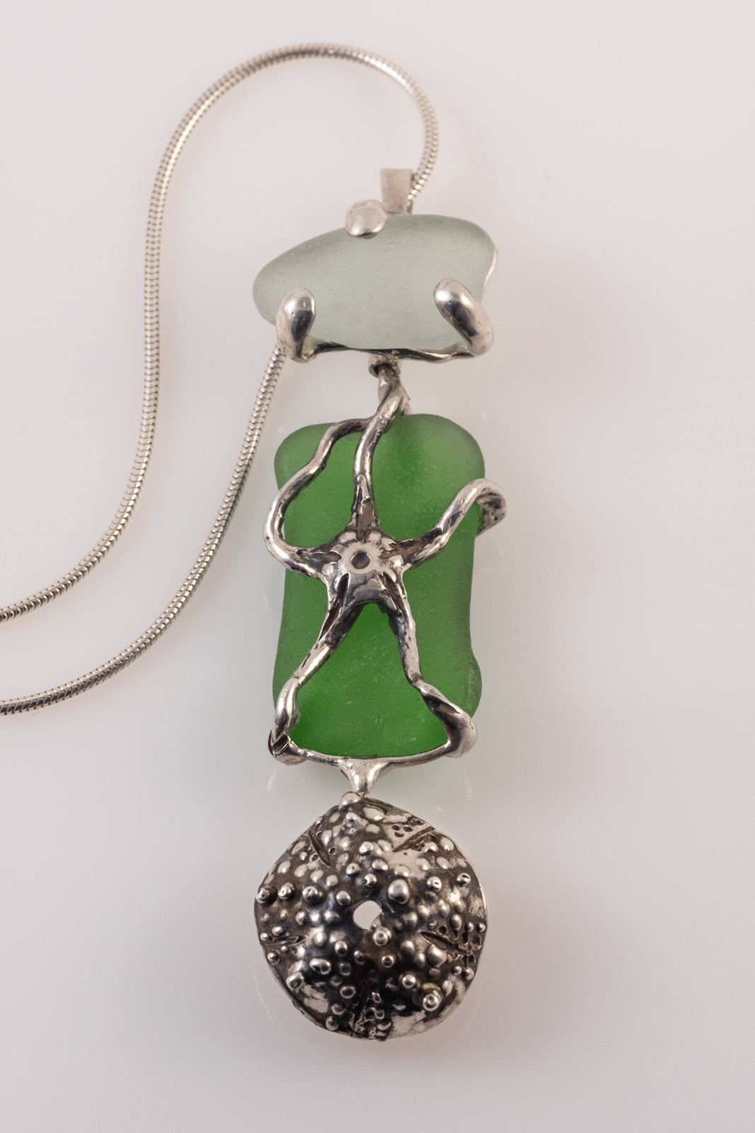 Silver starfish and sea urchin pendant with sea glass by VerdeRame Jewels