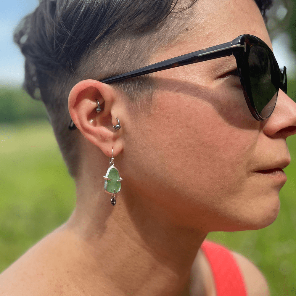 Sterling silver sea glass earrings with small textured charm