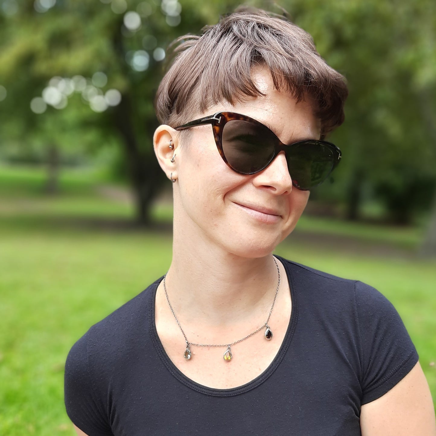 Elegant sterling silver necklace featuring three colourful teardrop crystals, handmade by VerdeRame Jewels.