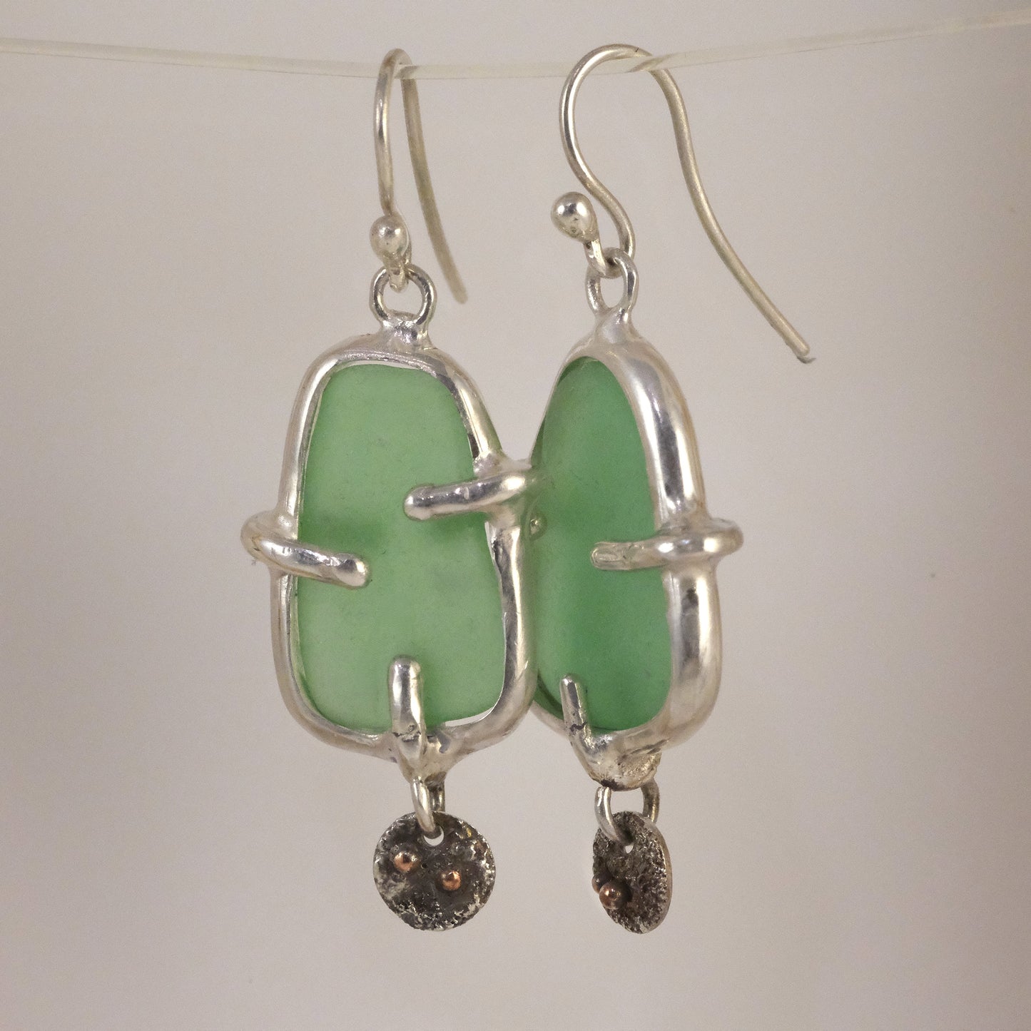 Sea glass silver dangle earrings handmade by VerdeRame Jewels