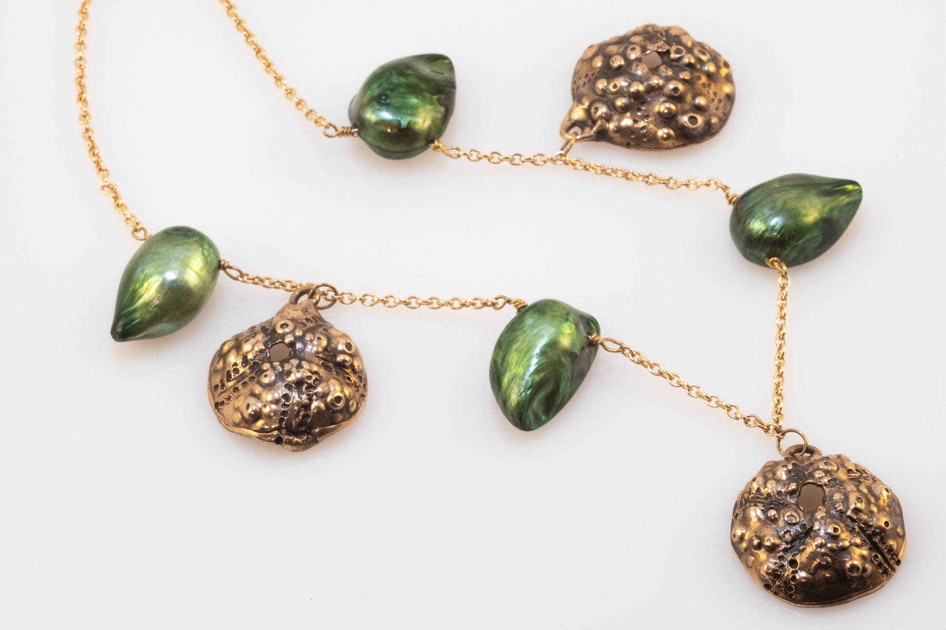 Gold-plated silver necklace with brass sea urchin pendants