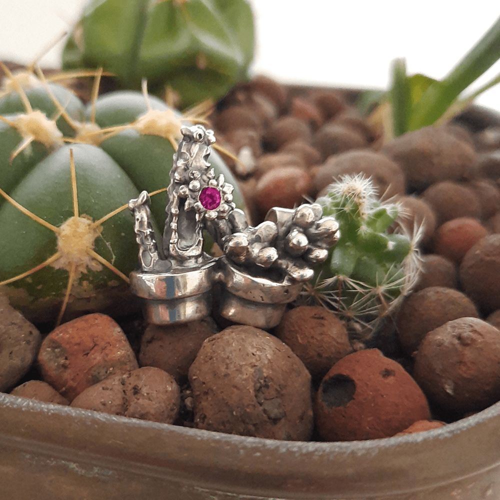 Mediterraneo collection pendant featuring two cactuses in silver pots