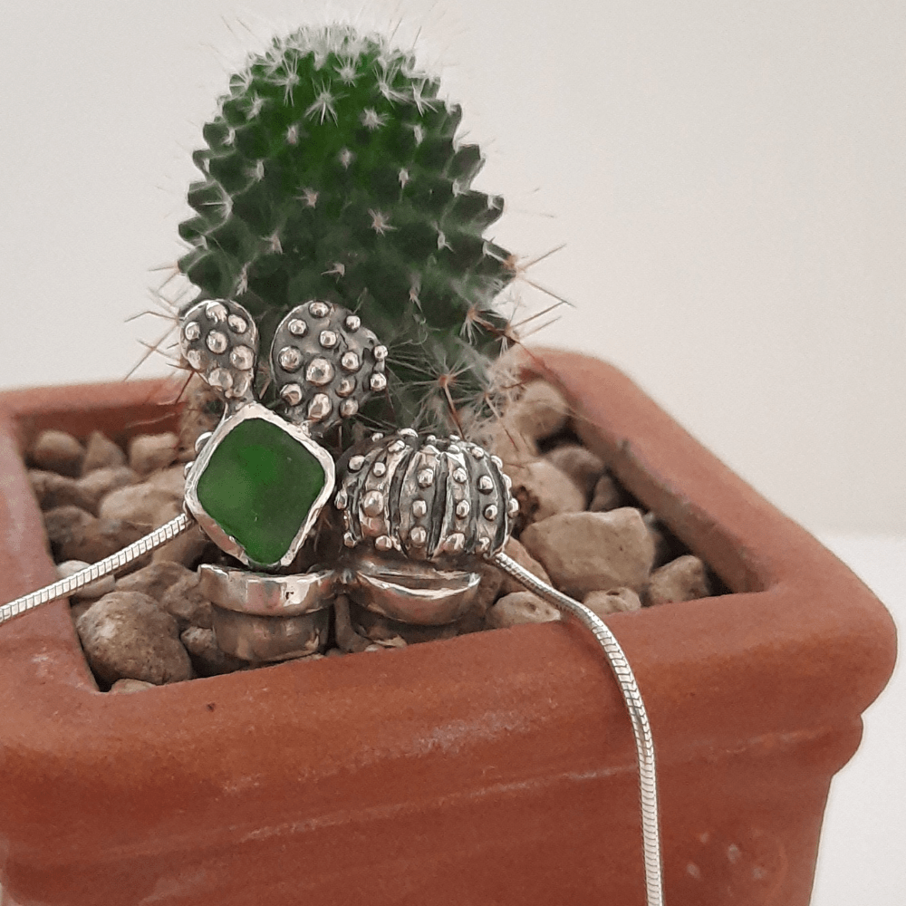 Detail of handmade sterling silver cacti pendant