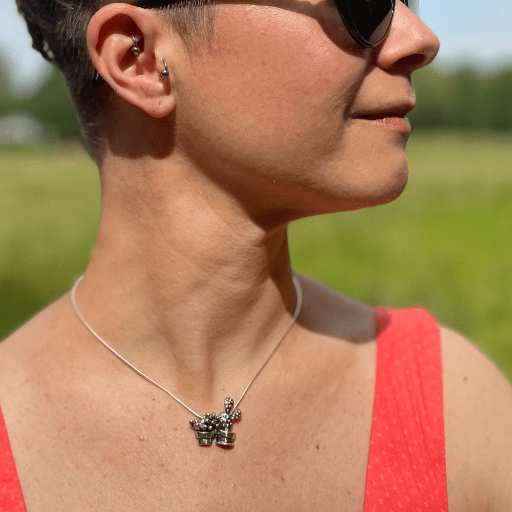 Artisan silver necklace featuring two cactuses in matching pots