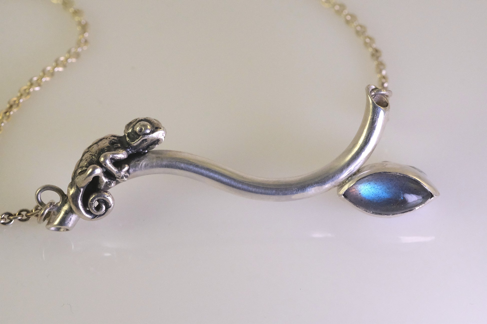 Silver chameleon necklace with blue labradorite cabochon