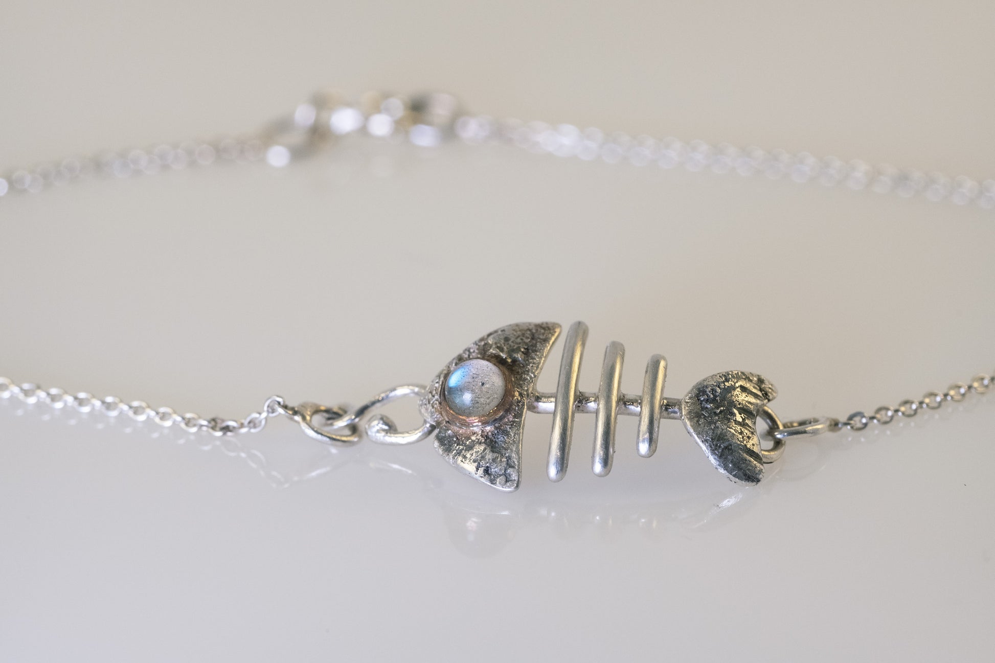 Sterling silver fish bone bracelet with labradorite eye detail