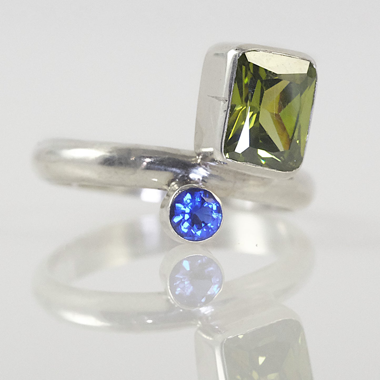 Double-stone silver ring with green and blue stones
