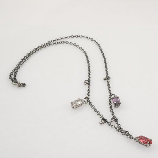 Quirky oxidised silver necklace with three marquise crystals in white, fuchsia, and purple, handmade by VerdeRame Jewels.