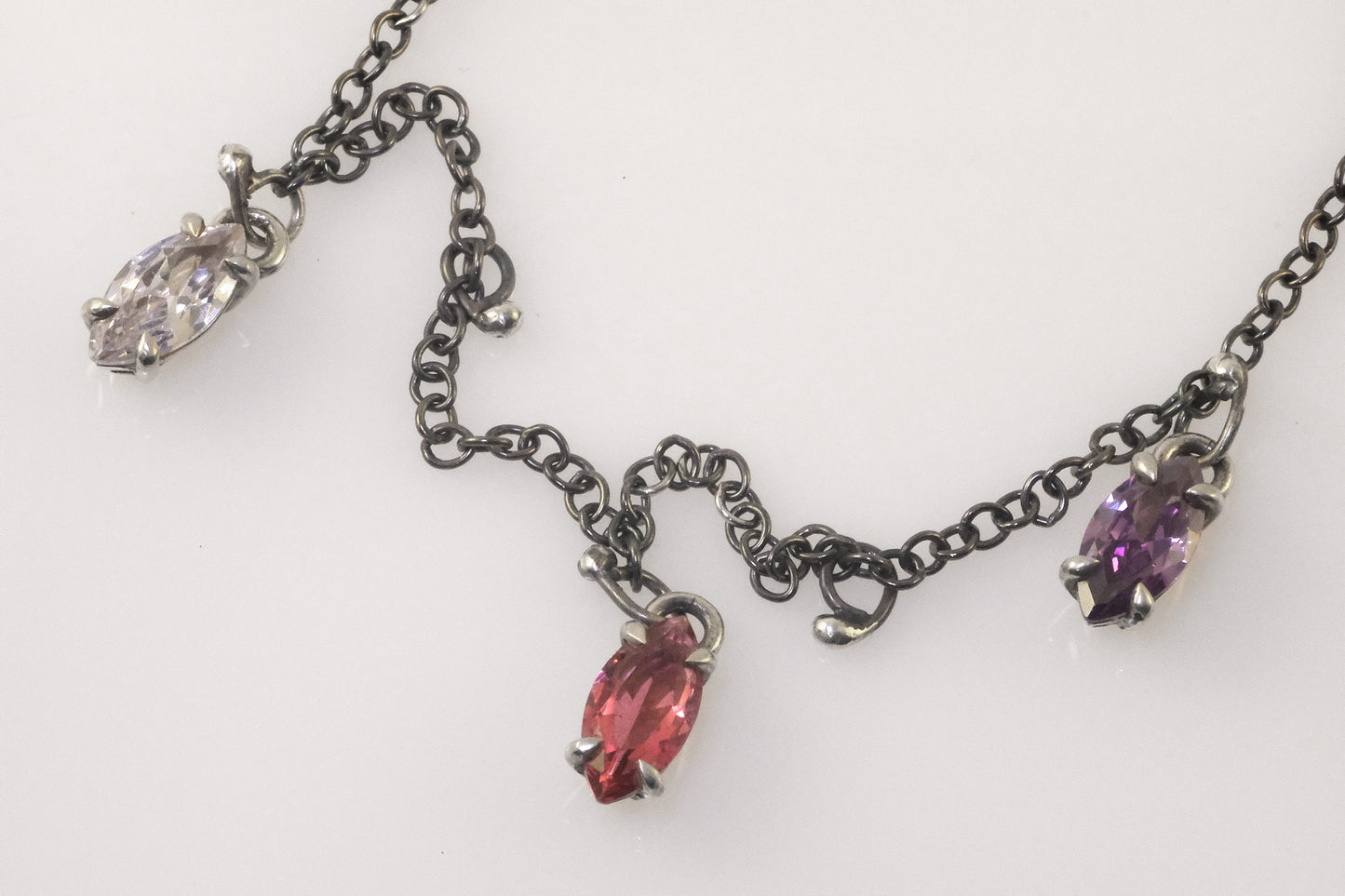 Detailed shot of multicoloured marquise crystals on a 45 cm sterling silver chain.