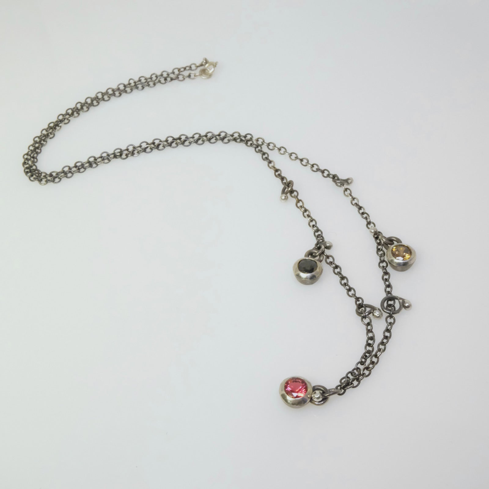 Handmade sterling silver necklace with round crystal bezel pendants and small ball charms