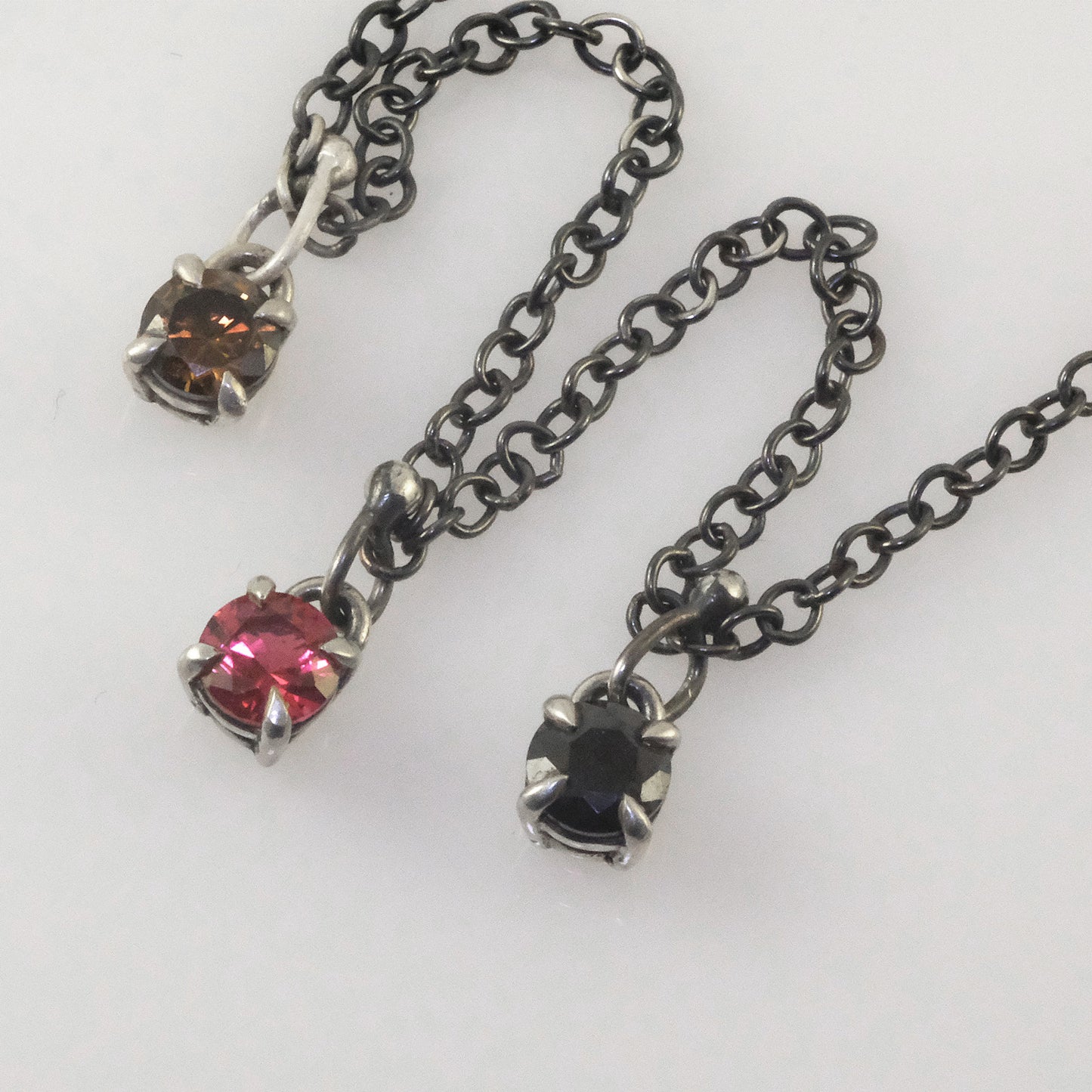 Delicate silver necklace with colourful round crystal pendants