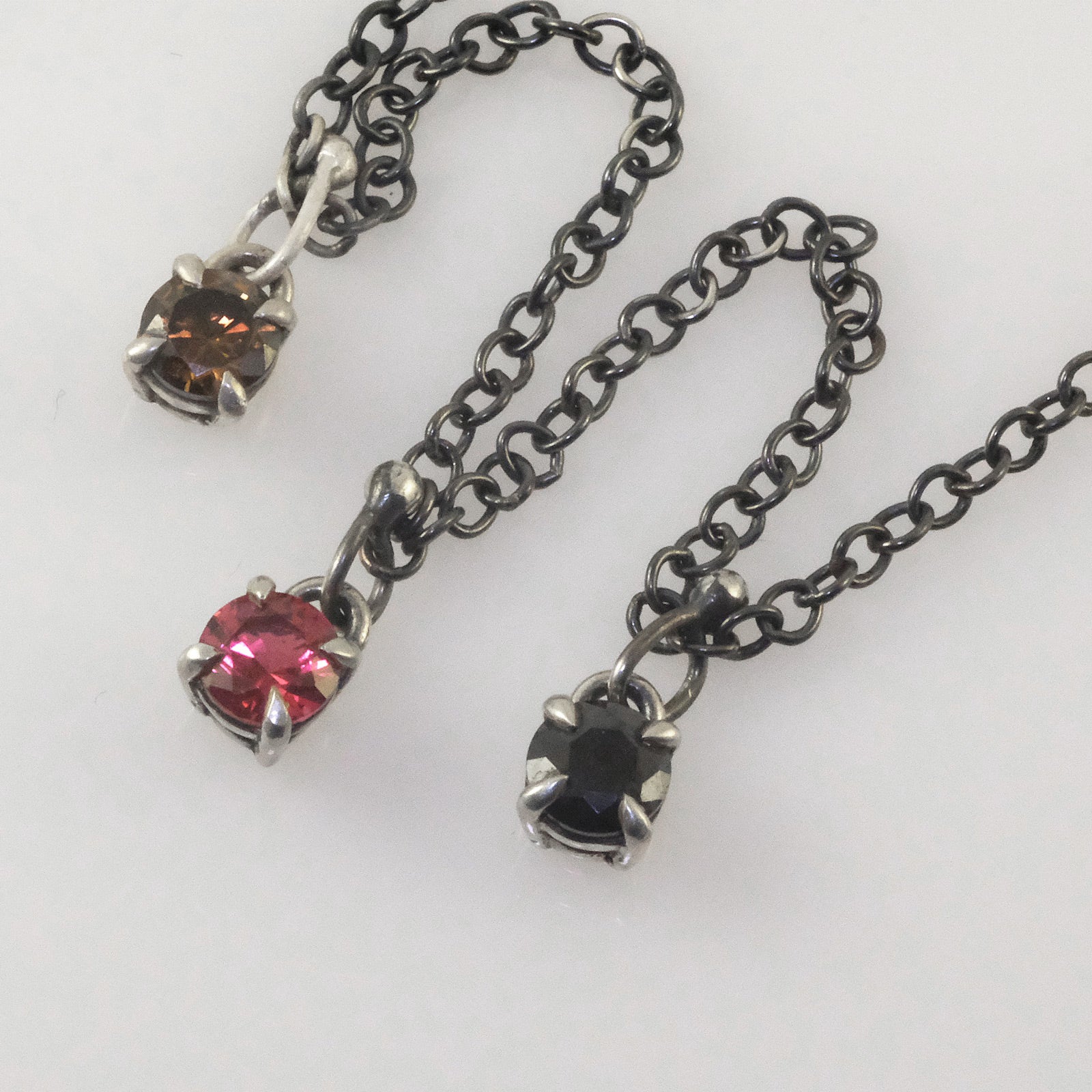 Delicate silver necklace with colourful round crystal pendants