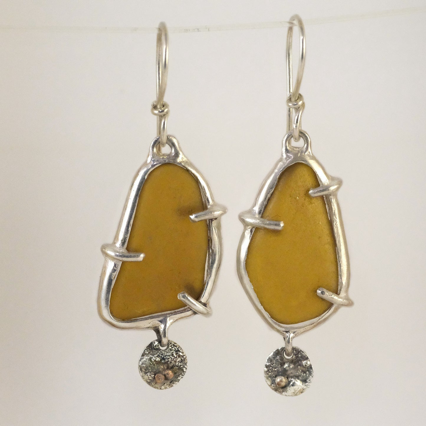 Brown sea glass earrings with textured silver charm handmade jewellery
