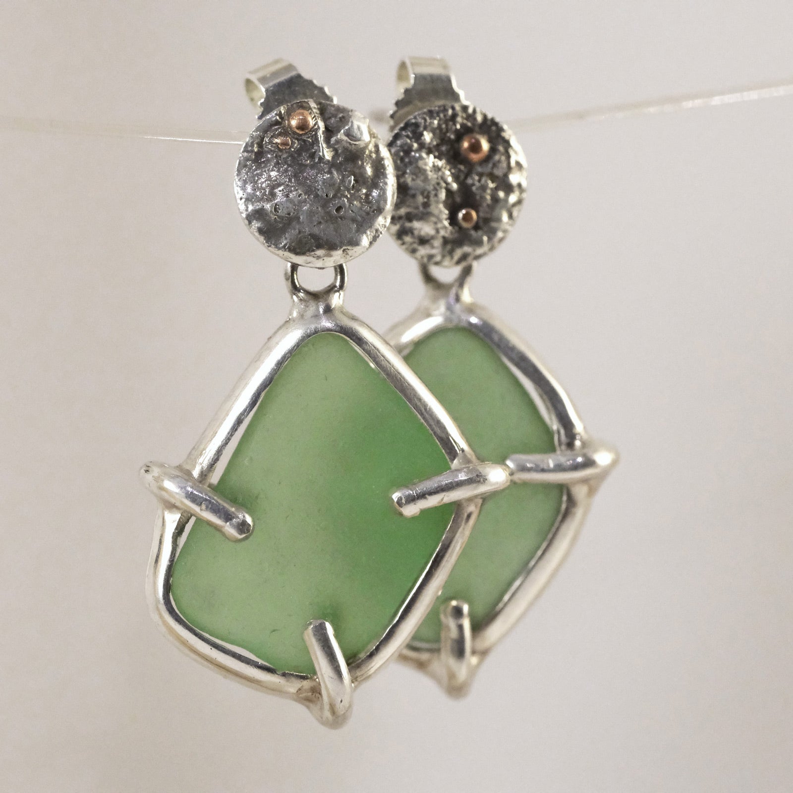 Handmade sea glass stud earrings with sterling silver plate and green sea glass