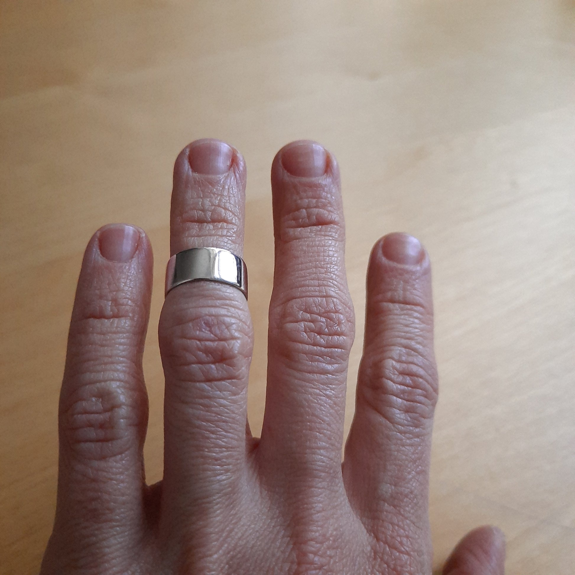 Versatile unisex sterling silver band ring design.