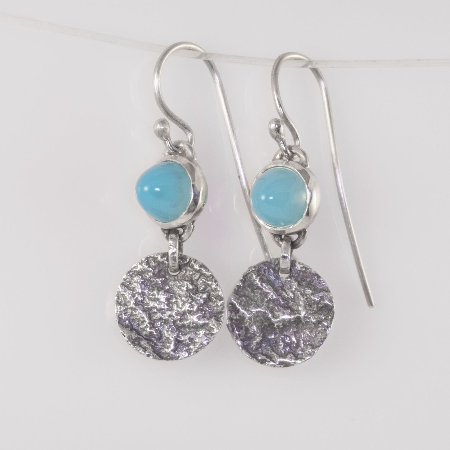 Handmade silver ripple earrings with blue chalcedony cabochons by VerdeRame Jewels