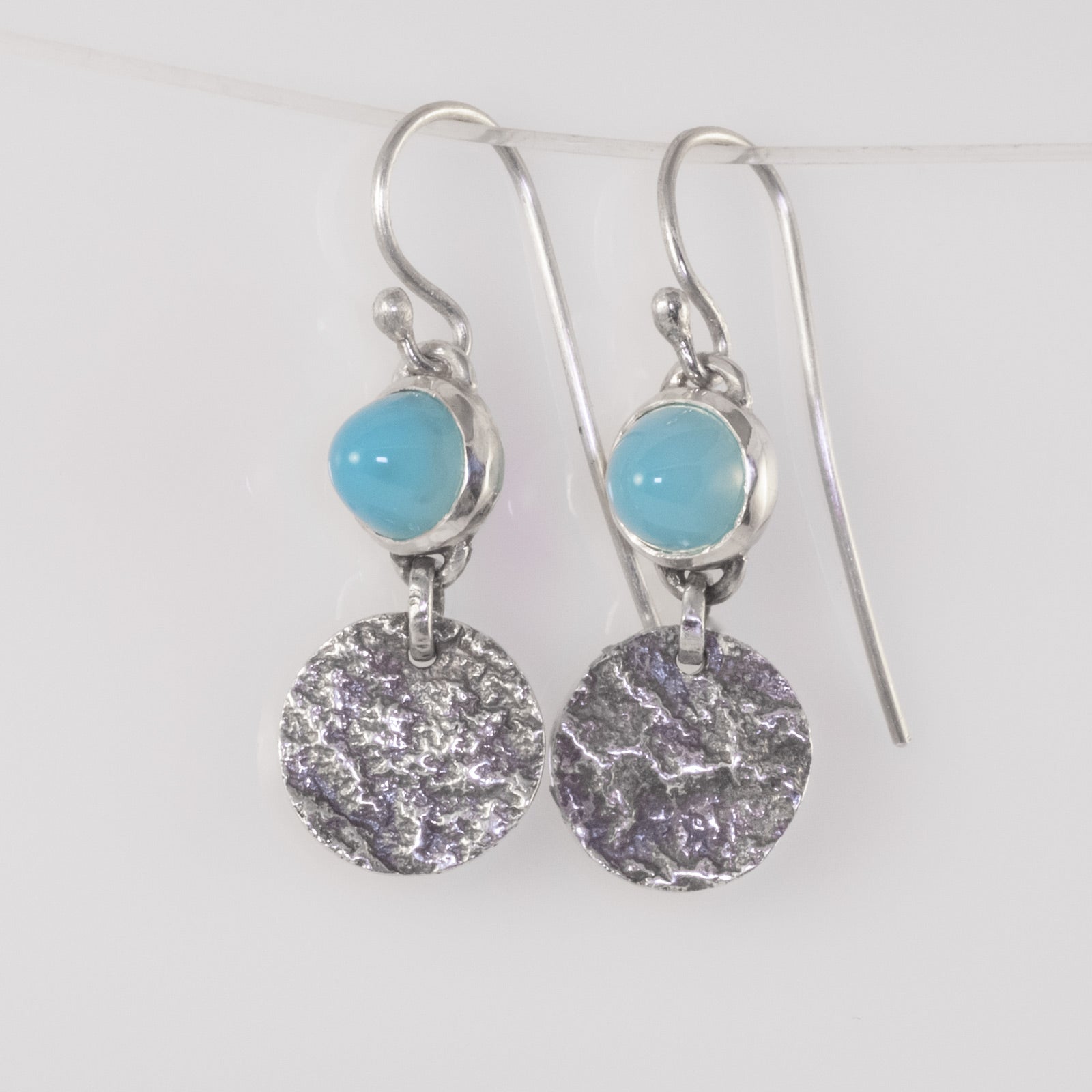 Handmade silver ripple earrings with blue chalcedony cabochons by VerdeRame Jewels