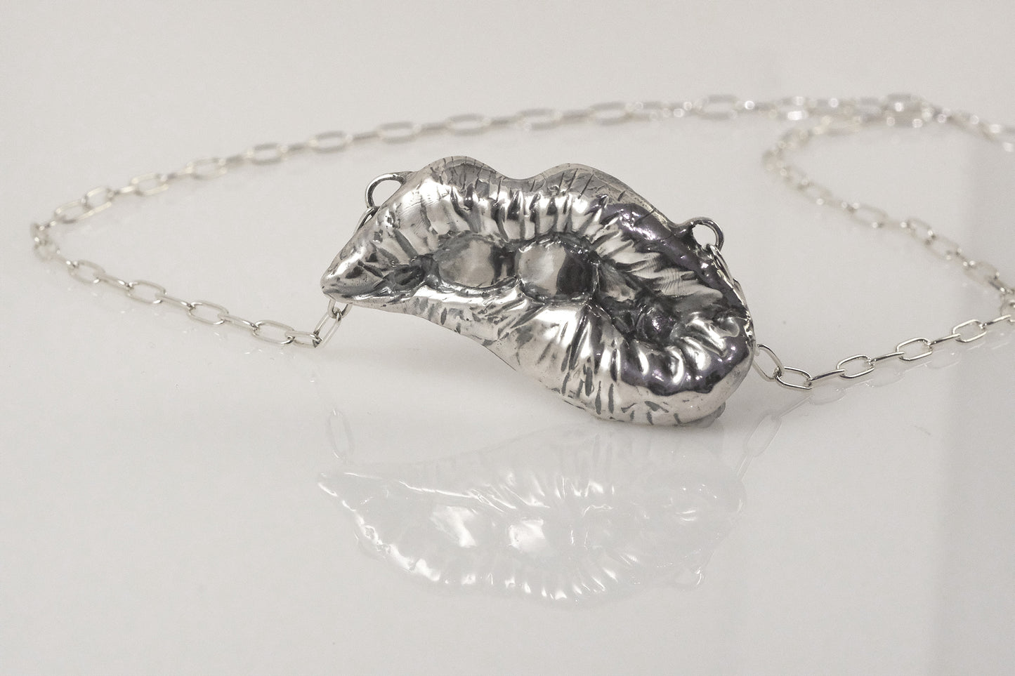 Handmade sterling silver lips necklace by VerdeRame Jewels