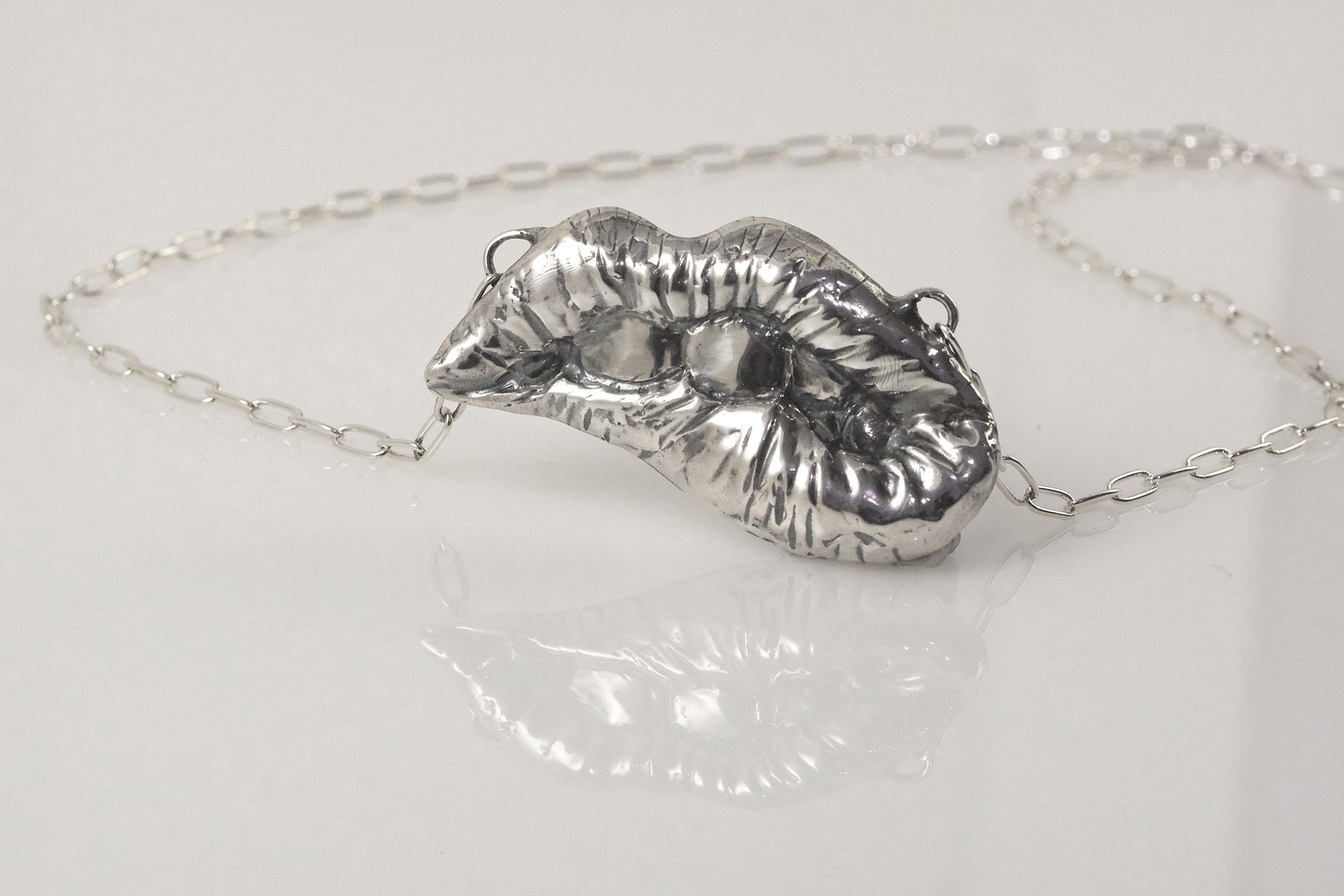 Handmade sterling silver lips necklace by VerdeRame Jewels
