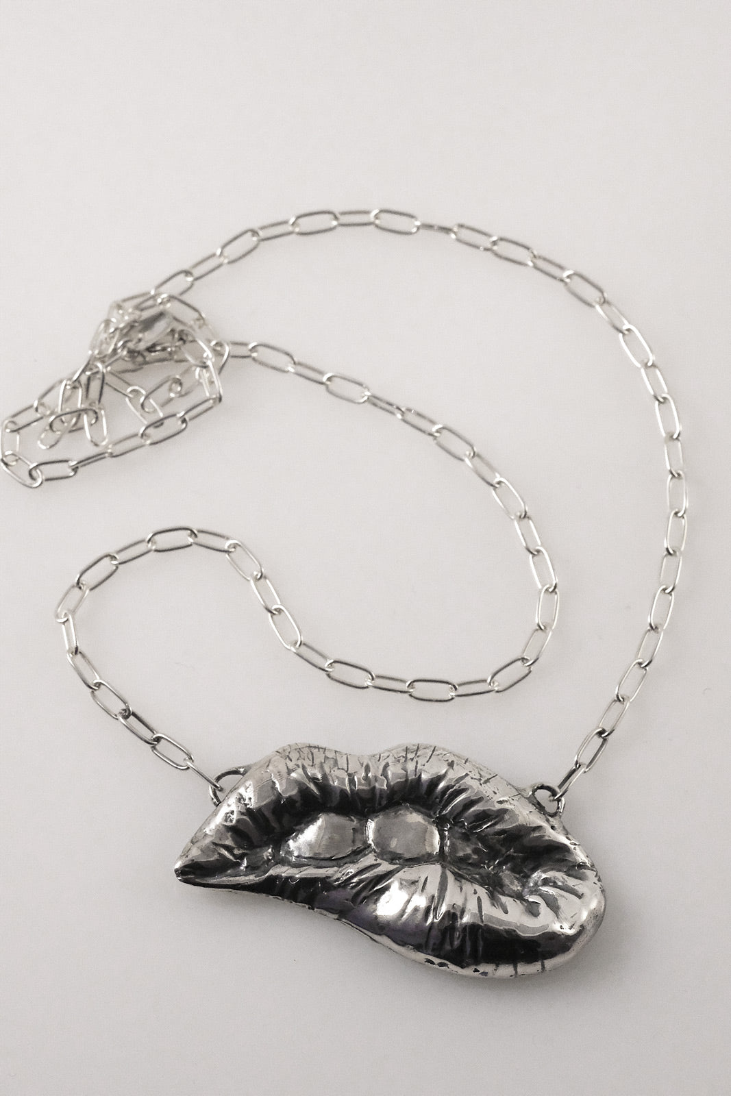 Quirky handmade lips necklace in sterling silver