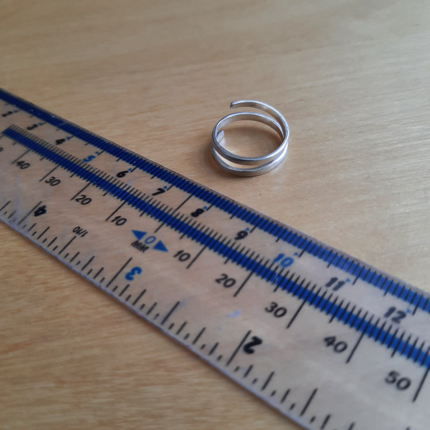 Artisan handmade spiral ring in polished 925 silver.