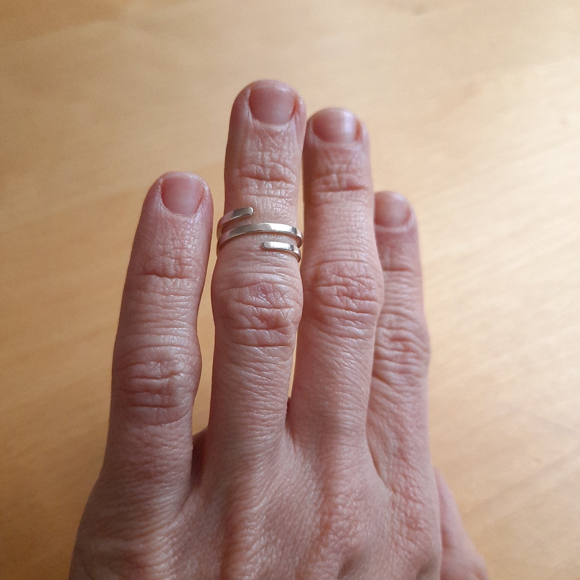 Minimal sterling silver spiral band ring made to order.