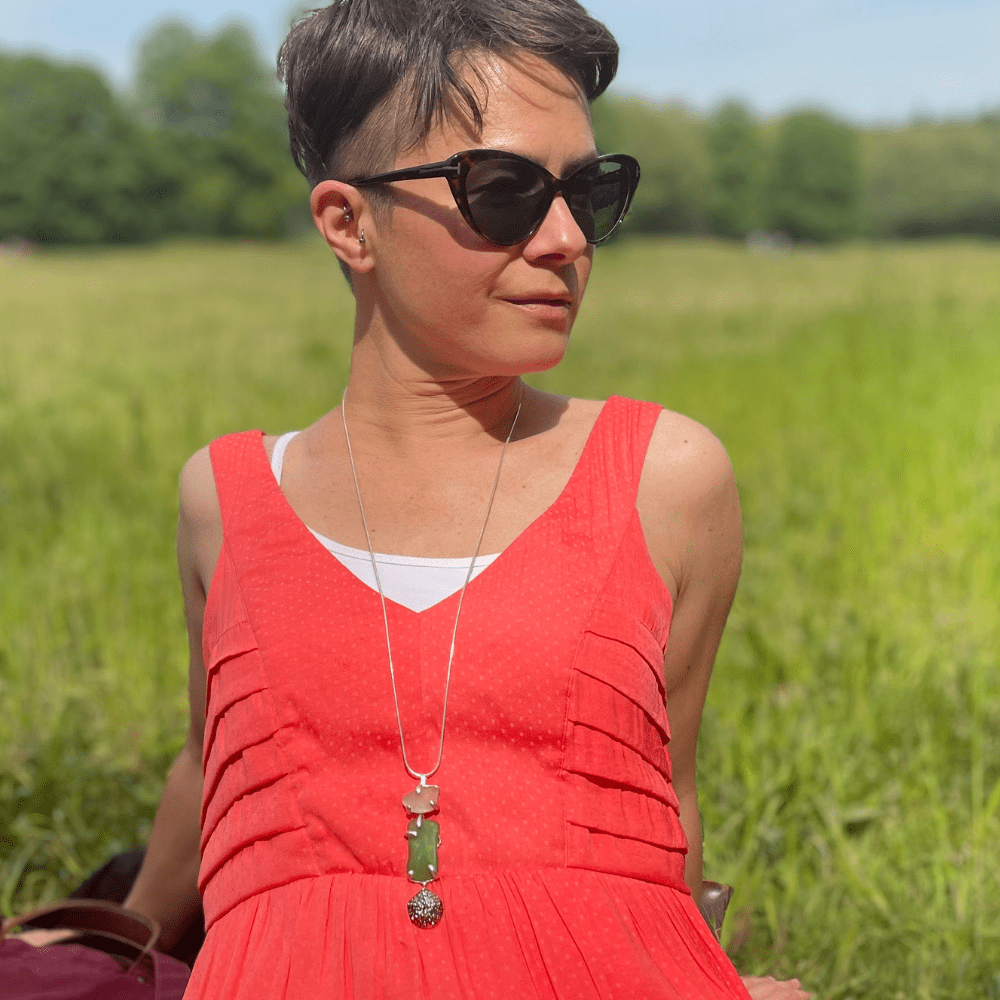 Artisan sea glass pendant with moving starfish element