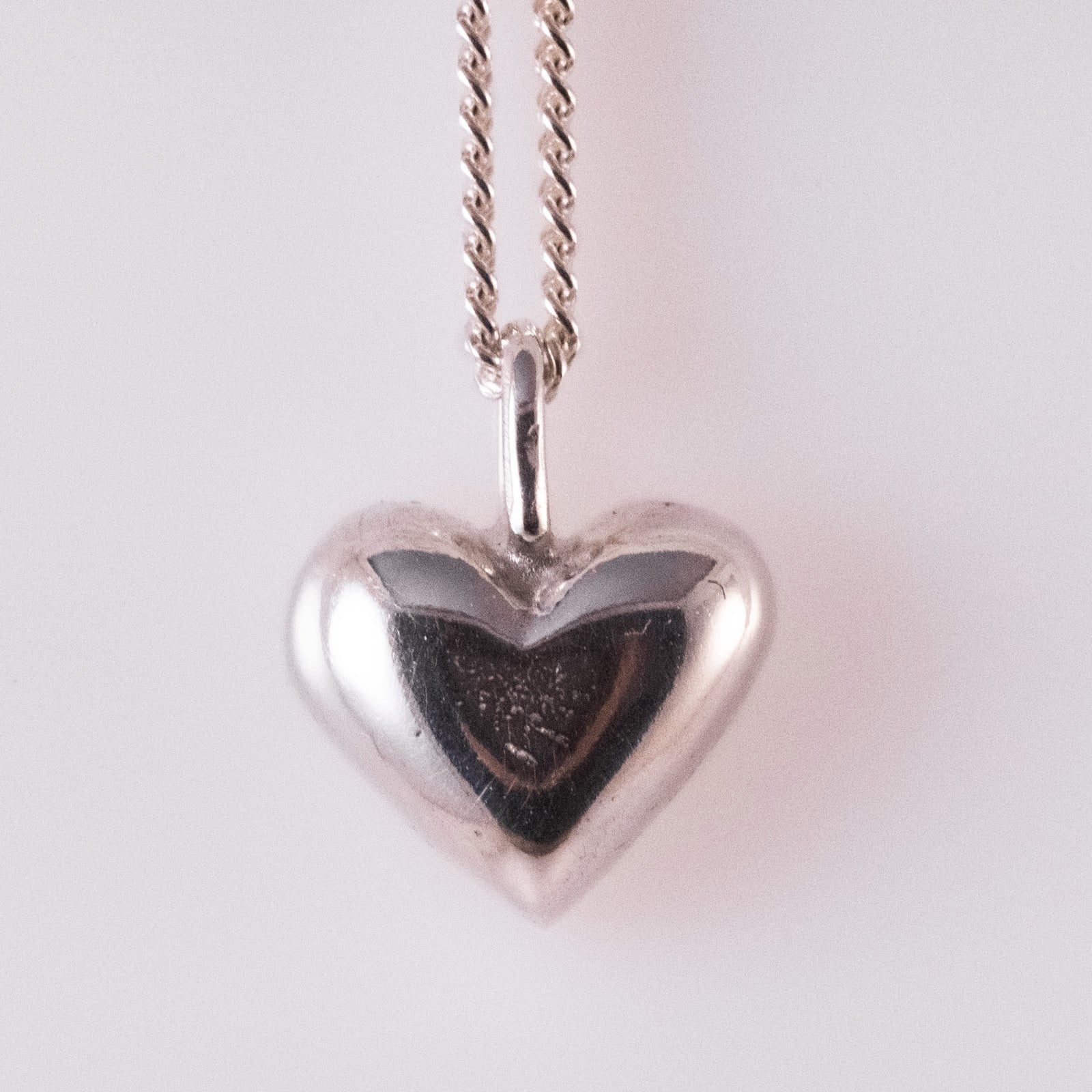 Sand-cast silver heart pendant by VerdeRame Jewels
