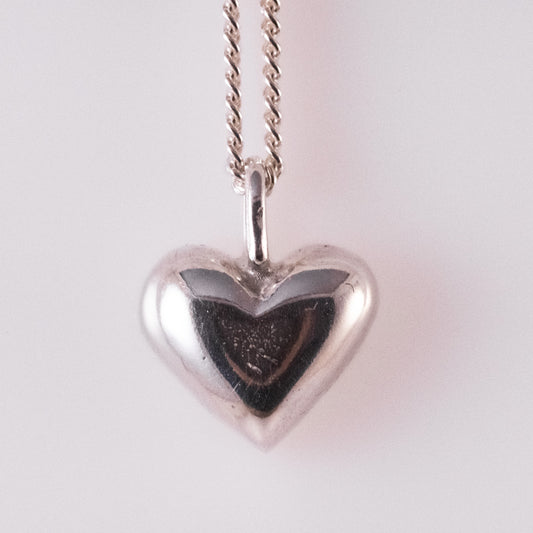 Sand-cast silver heart pendant by VerdeRame Jewels